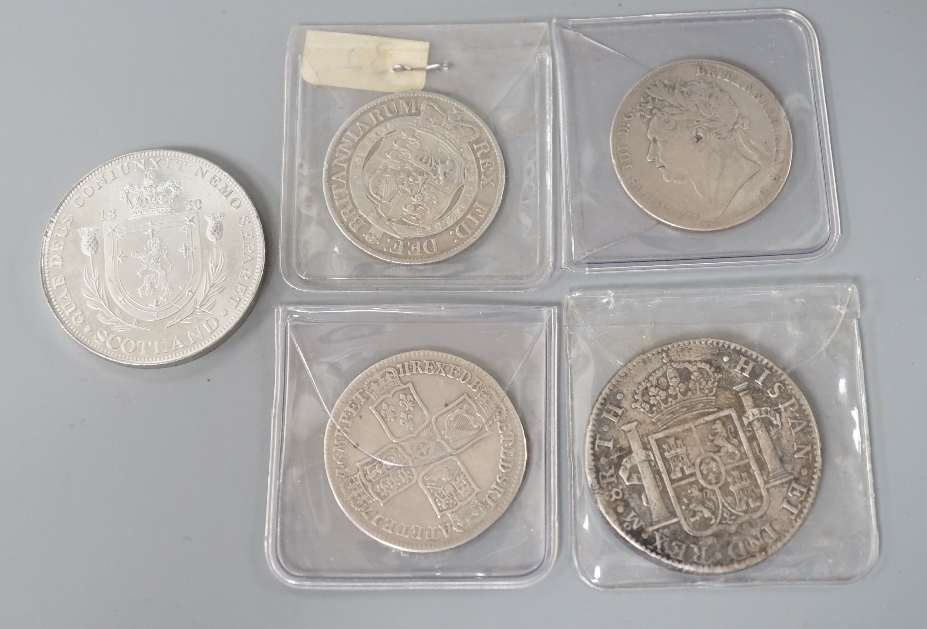 Three Georgian half crowns; 1746, 1818 & 1823 and two other coins.